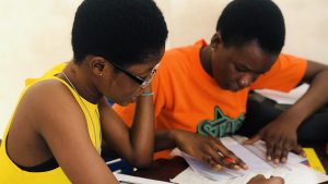 Female students creating a personalized study guide for 2023 WASSCE examination