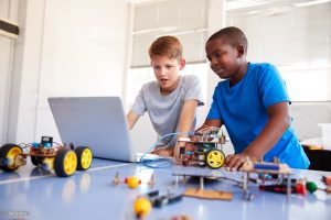 Two male students learning stem related course-Robotics