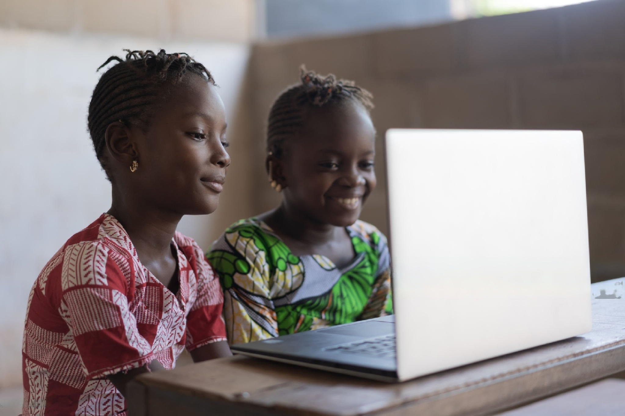 Ghanaian students using a laptop for researching